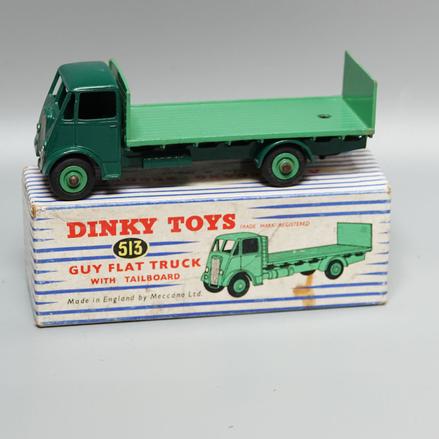 Dinky 513 Guy flat truck with tail board two tone green stripped box